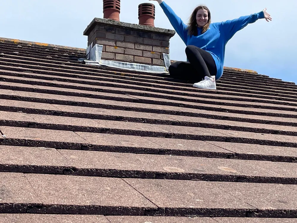 JMC HIGHVAC team member on a roof